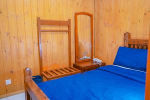 Postel nebo postele na pokoji v ubytování Blue Moon Residency