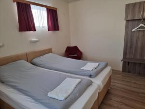 Postel nebo postele na pokoji v ubytování Litla-Hof Guesthouse