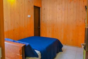 Postel nebo postele na pokoji v ubytování Blue Moon Residency