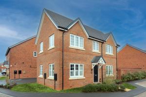 a large red brick house with white windows at Detached house with Netflix, gym, garden, BBQ, coffee and more in Tile Hill