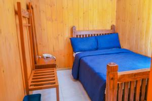 Postel nebo postele na pokoji v ubytování Blue Moon Residency