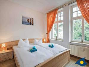 Ein Bett oder Betten in einem Zimmer der Unterkunft Villa Malve Wohnung 05