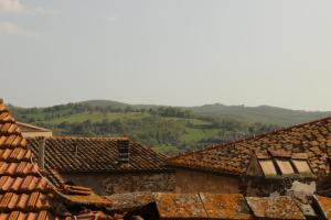 a view from the roofs of a village at Trilocale nel centro storico in Montemerano +3 photos
