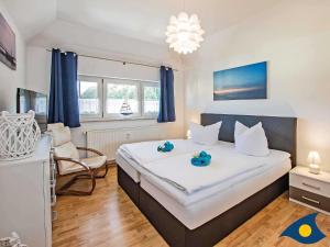 Postel nebo postele na pokoji v ubytování Villa Maria Gabriele Whg 13