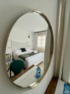 A bed or beds in a room at Posada la Leyenda