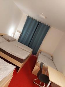 Postel nebo postele na pokoji v ubytování Penzion na hřišti