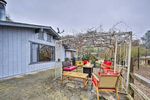 a patio with chairs and a table and a pergola at North Fork Vacation Rental 28 Mi to Yosemite in North Fork