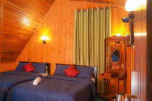 Postel nebo postele na pokoji v ubytování Blue Moon Residency
