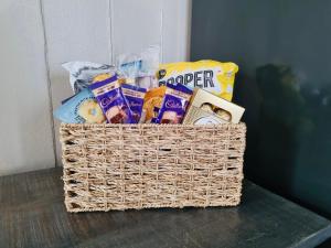 a basket filled with snacks on a table at College Hill Shrewsbury in Shrewsbury