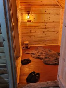 an inside view of a sauna with shoes on the floor at Gesatona Angel House in Fındıklı
