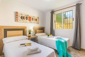 Postel nebo postele na pokoji v ubytování Villa Enzo Moraira