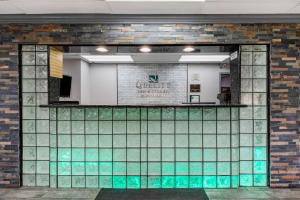 a pool in the lobby of a building at Quality Inn & Suites Ft Jackson Maingate in Columbia +25 photos