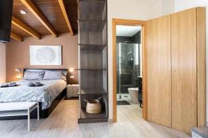 A bed or beds in a room at Sunnyland atico las teresitas 4
