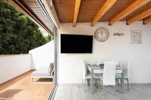 A television and/or entertainment centre at Sunnyland atico las teresitas 4
