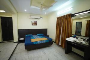 Postel nebo postele na pokoji v ubytování Kumbakonam homestay