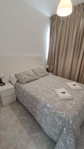 Posteľ alebo postele v izbe v ubytovaní Apartamento Blancomar