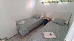 Posteľ alebo postele v izbe v ubytovaní Apartamento Blancomar