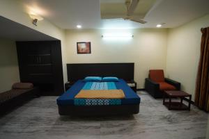 Postel nebo postele na pokoji v ubytování Kumbakonam homestay