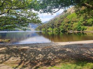 a view of a body of water with a mountain at Cracatinni Mews in Roundwood