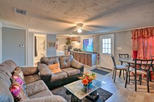a living room with a couch and a table at Shreveport Vacation Rental Near Riverfront in Shreveport