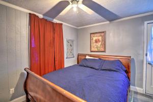 a bedroom with a bed and a ceiling fan at Shreveport Vacation Rental Near Riverfront in Shreveport