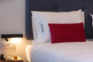 A bed or beds in a room at Lines Concept Accommodation