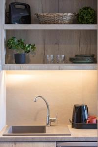 A kitchen or kitchenette at Lines Concept Accommodation