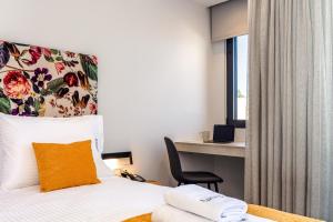 A bed or beds in a room at Lines Concept Accommodation