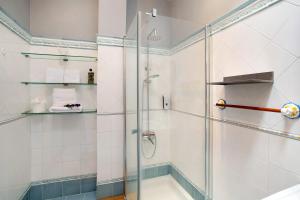 a shower with a glass door in a bathroom at Carmelo y Carmela 4 in Teror +26 photos
