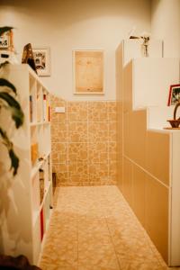 a bathroom with a tiled hallway with a tile floor at H.ö.H in Porto +71 photos