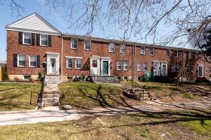 a large brick building with stairs in front of it at Recently renovated 3BR home near Heritage Park! in Dundalk