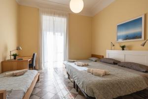 a room with four beds and a window at LT ATENEO in Bari