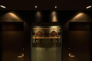 a basketball hoop in a dark room with lights at Catalonia Donosti in Donostia-San Sebastián