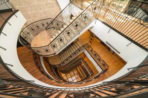 an overhead view of a spiral staircase in a building at Catalonia Donosti in Donostia-San Sebastián