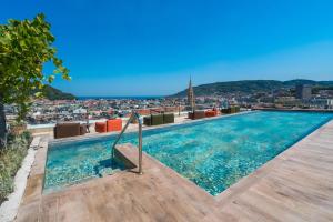 a swimming pool on the roof of a building at Catalonia Donosti in Donostia-San Sebastián