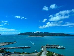 a view of a large body of water with boats at Jesselton Point Seaview Homestay Kota Kinabalu in Kota Kinabalu