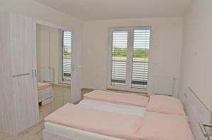 Posteľ alebo postele v izbe v ubytovaní Apartmány Vinohrady