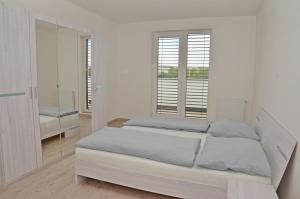 Posteľ alebo postele v izbe v ubytovaní Apartmány Vinohrady