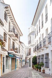 an empty street in a town with white buildings at Luxury Beach home in Fuengirola