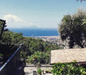 a view of the ocean from a house at La Dimora le Fumarole Rooms in Ercolano