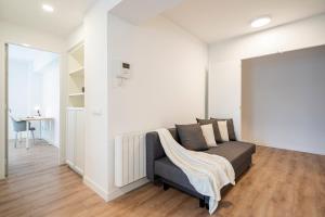 A seating area at For You Rentals Cozy Apartment TEMPORAL La Vaguada Madrid PMO10