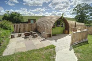 a yurt in a yard with a wooden fence at Finest Retreats - Humbleton Glamping in Hexham