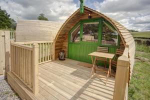 a gazebo with a table on a deck at Finest Retreats - Barebones Glamping in Hexham