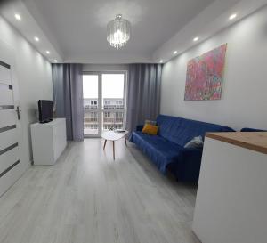 Televízia a/alebo spoločenská miestnosť v ubytovaní Welcome Apartment