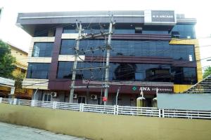 a building under construction with scaffolding in front of it at AWA Residency in Cochin