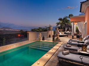 a swimming pool on top of a house at Royal Garden Villas, Luxury Hotel in Adeje