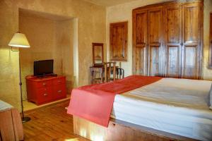 Postel nebo postele na pokoji v ubytování 4 Oda Cave House - Special Class