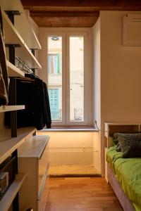 A bed or beds in a room at Dimora San Vitale - in the heart of Verona
