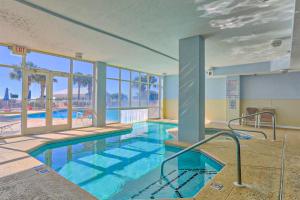 a swimming pool in a building with a swimming pool at The Dunes 704 in Gulf Shores