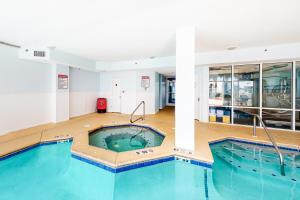 a large swimming pool in the middle of a building at The Dunes 704 in Gulf Shores